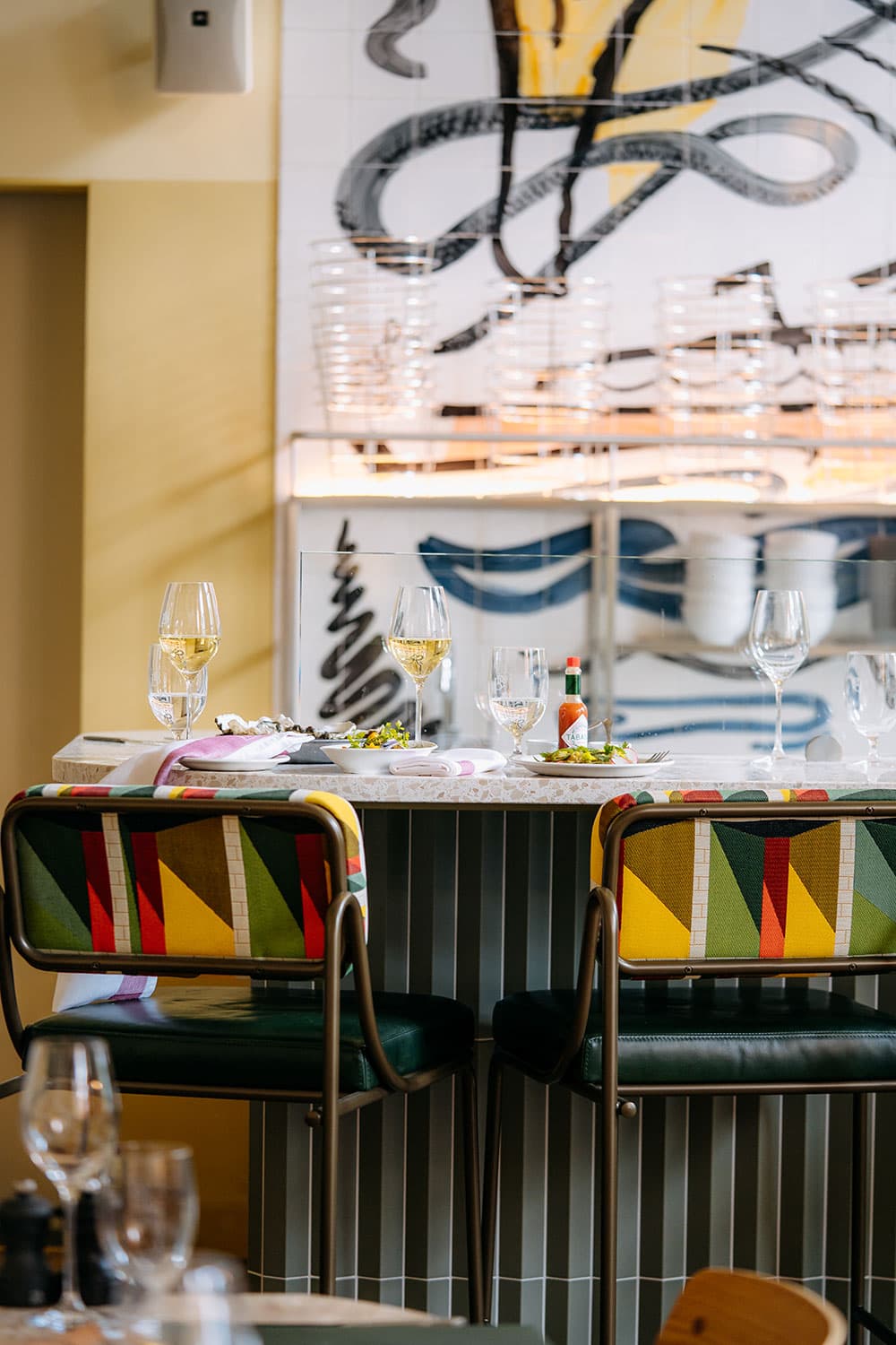 Colourful stools by the bar